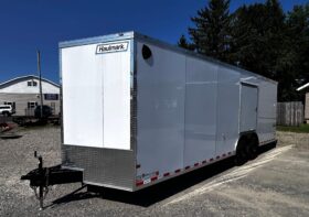 2027 HAULMARK TRANSPORT PREMIUM 8.5′ x 24′ ENCLOSED CAR TRAILER-12,000 GVW, V-NOSE, 16″ WHEELS, ESCAPE DOOR, BOGEY WHEELS, STABILIZER JACKS, ELECTRIC BRAKES AND REAR RAMP DOOR (TSV8524T4)-WHITE
